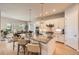 Modern kitchen with granite countertops, stainless steel appliances, and breakfast bar seating at 1766 Summerglow Ln, Monument, CO 80132