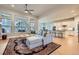 Open-concept living room with high ceilings, hardwood floors, and modern decor at 1766 Summerglow Ln, Monument, CO 80132