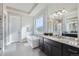 Spa-like main bathroom with a soaking tub, marble counters, and a glass-enclosed shower at 1766 Summerglow Ln, Monument, CO 80132
