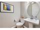 Chic powder room with stylish fixtures, a pedestal sink, and elegant decor at 1766 Summerglow Ln, Monument, CO 80132