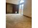 Carpeted bedroom with sliding glass doors that provide outdoor access at 12973 E Cornell Ave, Aurora, CO 80014