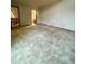 A large bonus room with neutral carpet, offering flexibility for various uses at 12973 E Cornell Ave, Aurora, CO 80014