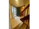 An inviting entryway with tile floors and stairs leading to an upper level at 12973 E Cornell Ave, Aurora, CO 80014