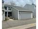 Charming two-story townhome with an attached two-car garage and well-maintained landscaping at 12973 E Cornell Ave, Aurora, CO 80014