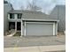 Charming two-story townhome with an attached two-car garage, showing the entrance at 12973 E Cornell Ave, Aurora, CO 80014