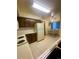Eat-in kitchen featuring tile flooring, ceiling fan, and a dining table with iron chairs for a cozy meal at 12973 E Cornell Ave, Aurora, CO 80014