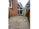 Paver patio with brick siding and wall of windows, connecting indoor and outdoor living at 12973 E Cornell Ave, Aurora, CO 80014