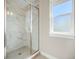 Shower with marble tile and glass enclosure at 921 Raleigh St, Denver, CO 80204
