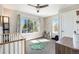 Second bedroom with crib, large window and plenty of natural light at 921 Raleigh St, Denver, CO 80204