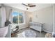 Charming Bedroom with a crib, rocking chair, and star wall decals at 921 Raleigh St, Denver, CO 80204