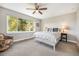 Spacious bedroom with large window, ceiling fan, and ample natural light at 921 Raleigh St, Denver, CO 80204