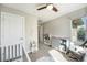 Bright Bedroom features a crib, dresser, and rocking chair at 921 Raleigh St, Denver, CO 80204