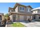 Modern two-story home with stone accents and a two-car garage at 921 Raleigh St, Denver, CO 80204