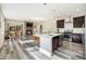 Open concept kitchen with island, dining area and fireplace at 921 Raleigh St, Denver, CO 80204