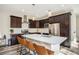 Spacious kitchen with dark cabinetry, quartz counters, and island at 921 Raleigh St, Denver, CO 80204