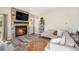 Living room boasts a cozy stone fireplace and ample natural light at 921 Raleigh St, Denver, CO 80204