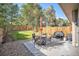 Backyard patio features a table, chairs, and grill at 921 Raleigh St, Denver, CO 80204