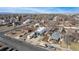 Neighborhood aerial view featuring unique home and garage; RV parked on property at 410 Goodrich Ave, Platteville, CO 80651