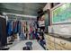 Organized walk-in closet with clothing racks, shelves, and soft lighting at 410 Goodrich Ave, Platteville, CO 80651