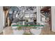 Open-concept living and dining area boasts unique architectural details and natural light at 410 Goodrich Ave, Platteville, CO 80651
