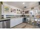 A well-lit kitchen featuring stainless steel appliances, concrete countertops, and ample natural light at 410 Goodrich Ave, Platteville, CO 80651