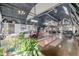 Expansive living room in a Quonset-style home featuring a pool table, unique art, and interior design at 410 Goodrich Ave, Platteville, CO 80651