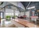 Open living space with a pool table, projector screen, and bright interiors inside a Quonset-style home at 410 Goodrich Ave, Platteville, CO 80651