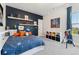 bedroom featuring a celestial-themed bed, playful decor, shelves, and a telescope by a window at 20998 E 60Th Pl, Aurora, CO 80019