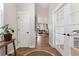 Bright foyer with hardwood floors and view to the living room at 20998 E 60Th Pl, Aurora, CO 80019