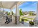 Inviting front porch with comfortable seating and neighborhood views at 20998 E 60Th Pl, Aurora, CO 80019