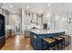 Bright kitchen with center island, modern lighting, and stainless steel appliances at 20998 E 60Th Pl, Aurora, CO 80019