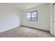 Bedroom with carpet, window, and neutral paint at 1700 W 102Nd Ave, Thornton, CO 80260