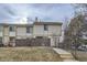 Charming townhome with a brick wall and manicured lawn with a walkway leading to the property at 1700 W 102Nd Ave, Thornton, CO 80260