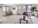 Inviting living room and dining area with a large window, stylish rug, and comfortable seating at 1700 W 102Nd Ave, Thornton, CO 80260