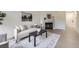 Cozy living room featuring a comfortable sofa, stylish rug, decorative fireplace and bright light at 1700 W 102Nd Ave, Thornton, CO 80260