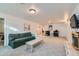 Large basement featuring a fireplace, carpet, a sofa, and ample space at 3643 E Lake Dr, Centennial, CO 80121