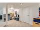Finished basement area featuring play kitchens, neutral carpet, and recessed lighting at 3643 E Lake Dr, Centennial, CO 80121