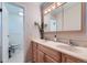 Bathroom featuring a double vanity, stylish light fixtures, and a view of the toilet at 3643 E Lake Dr, Centennial, CO 80121