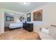 Comfortable bedroom with natural light, hardwood floors, and stylish decor at 3643 E Lake Dr, Centennial, CO 80121