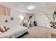 Bright bedroom features carpeted floor, desk, mirror, and closet at 3643 E Lake Dr, Centennial, CO 80121