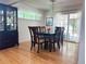 Elegant dining area featuring hardwood floors, stylish decor, and abundant natural light for memorable meals at 3643 E Lake Dr, Centennial, CO 80121