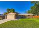 Charming single-story home with well-maintained lawn, attached two-car garage, and beautiful brick accents at 3643 E Lake Dr, Centennial, CO 80121