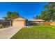 Charming single-story home with well-maintained lawn, attached two-car garage, and beautiful brick accents at 3643 E Lake Dr, Centennial, CO 80121