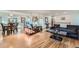 Open-concept living area with hardwood floors, elegant furnishings, and plenty of natural light for relaxation at 3643 E Lake Dr, Centennial, CO 80121