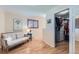Cozy seating area with wood floors, a shuttered window, and a glimpse into a walk-in closet at 3643 E Lake Dr, Centennial, CO 80121