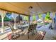 Covered patio area featuring a table and chairs, with backyard views at 3643 E Lake Dr, Centennial, CO 80121