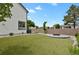 Beautiful backyard featuring artificial grass, a modern fence, and a charming fire pit area, perfect for relaxation at 17303 E Dewberry Cir, Parker, CO 80134