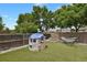 Backyard featuring a playhouse, hammock, and fenced yard for outdoor fun at 17303 E Dewberry Cir, Parker, CO 80134