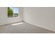 Bedroom featuring neutral carpet and natural light from a large window at 17303 E Dewberry Cir, Parker, CO 80134