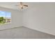 Bedroom with neutral carpet, ceiling fan and natural light from a window at 17303 E Dewberry Cir, Parker, CO 80134